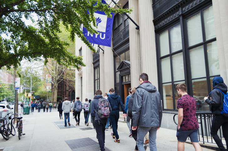 A group of students going to class at NYU.